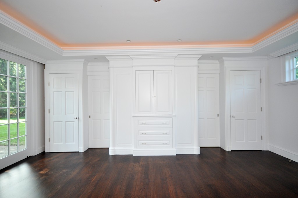 285 Musketaquid Road Concord, MA 01742 - Photo 13 of 30 a view of an empty room with wooden floor and a window