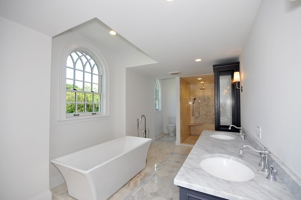 285 Musketaquid Road Concord, MA 01742 - Photo 18 of 30 a bathroom with a tub sink and mirror