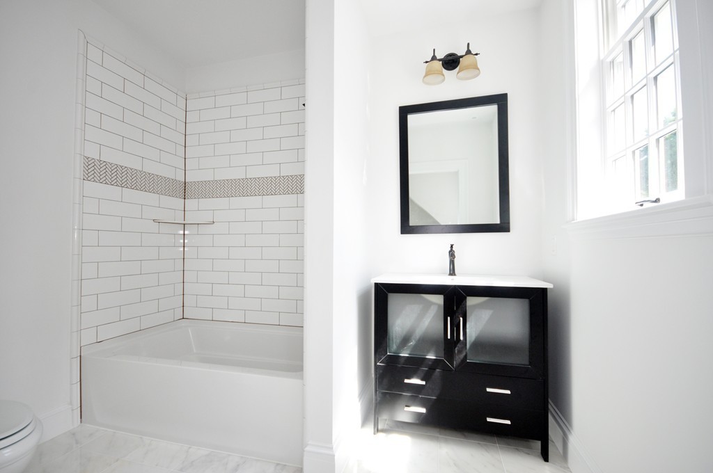 285 Musketaquid Road Concord, MA 01742 - Photo 22 of 30 a bathroom with a bathtub and a shower