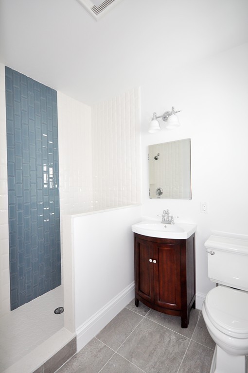 285 Musketaquid Road Concord, MA 01742 - Photo 23 of 30 a bathroom with a toilet a sink and mirror