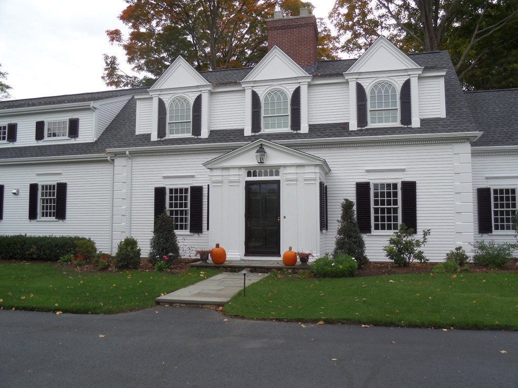285 Musketaquid Road Concord, MA 01742 - Photo 3 of 30 a front view of a house with a garden and plants