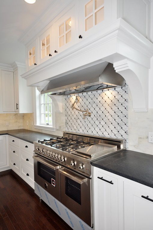 285 Musketaquid Road Concord, MA 01742 - Photo 10 of 30 a kitchen with granite countertop a stove and a sink