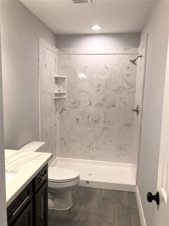 6207 Conley Street Houston, TX 77021 - Photo 7 of 9 a bathroom with a granite countertop sink toilet and shower