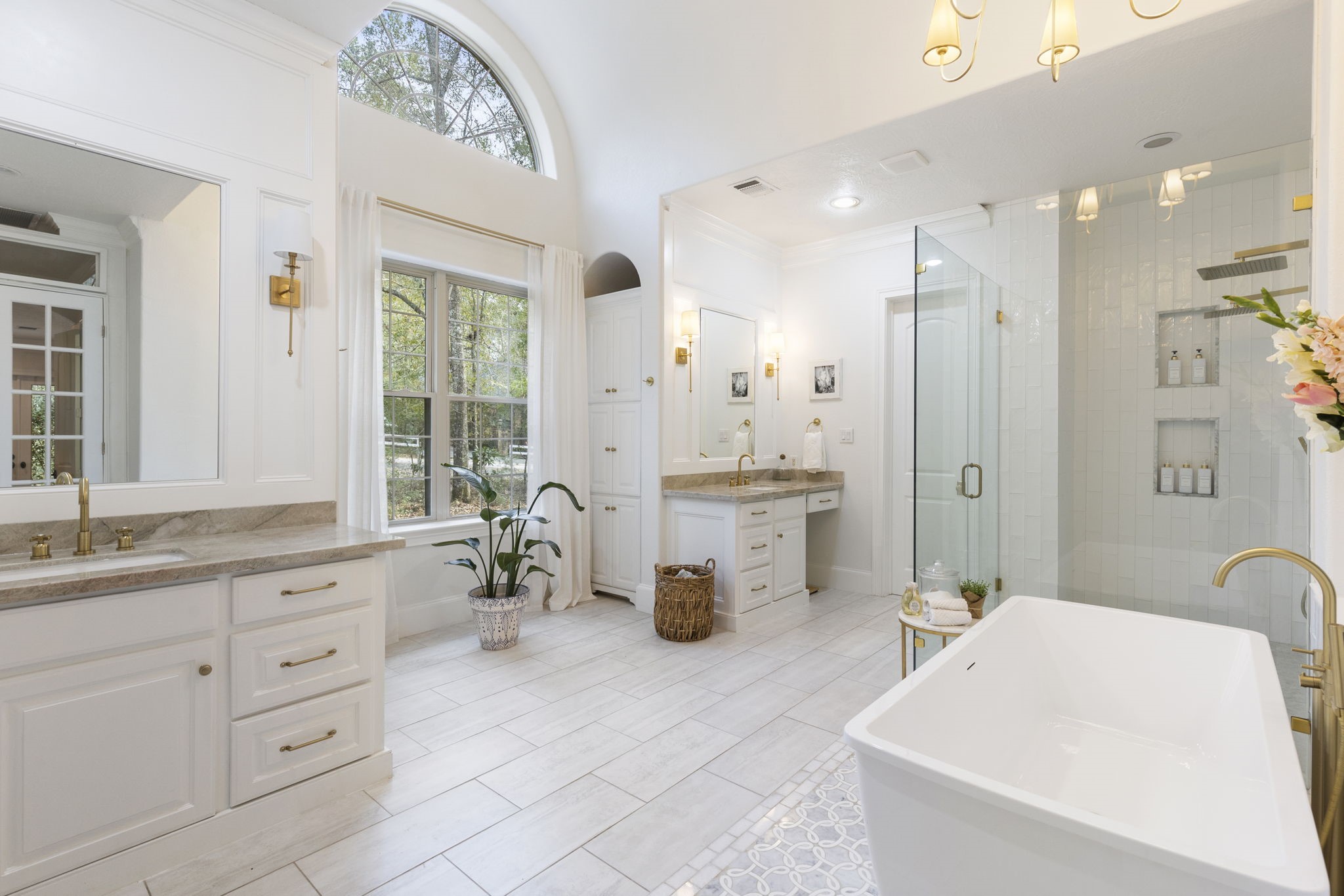 7421 Enchanted Stream Drive Conroe, TX 77304 - Photo 1 of 50 a bathroom with a tub sink and mirror