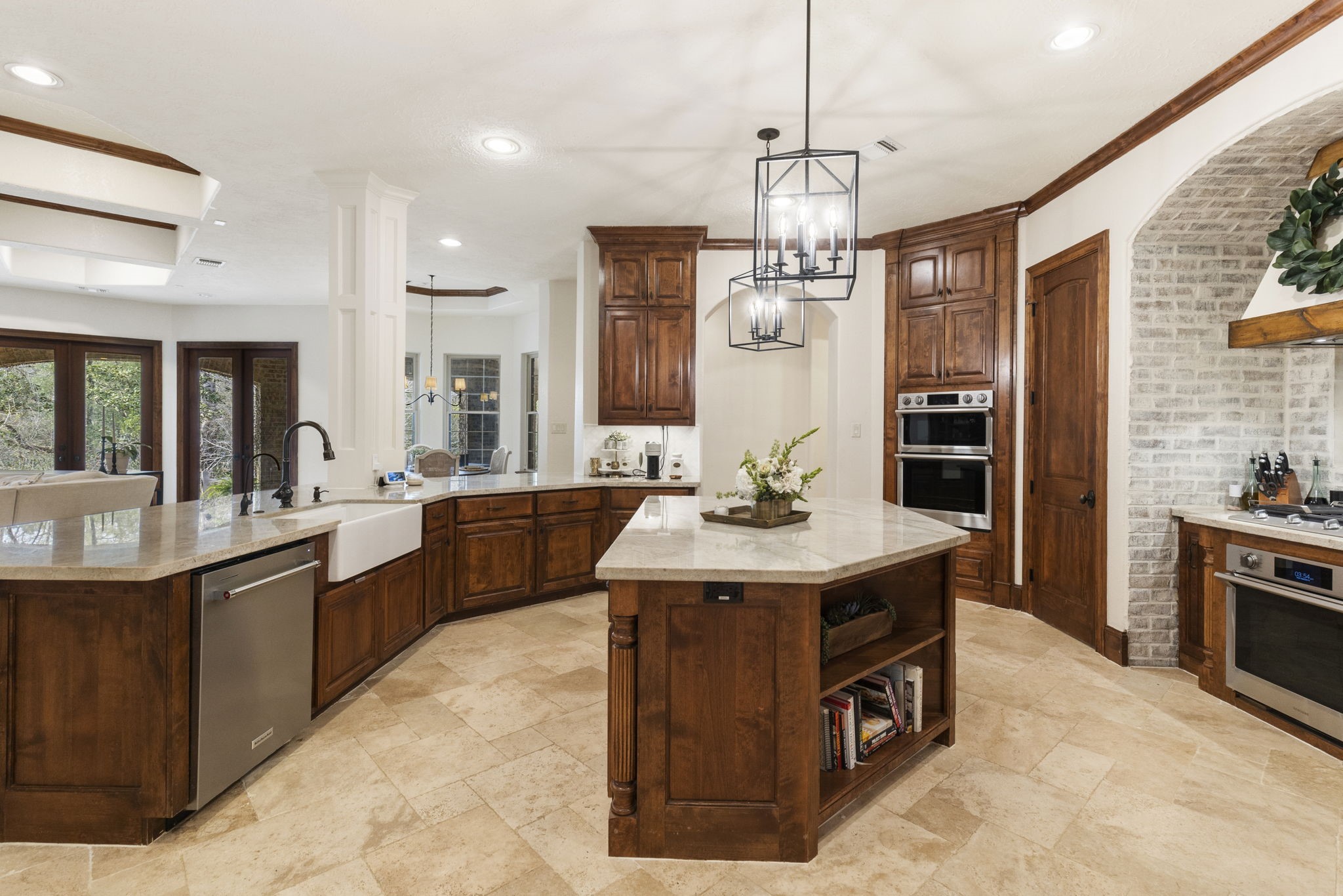 7421 Enchanted Stream Drive Conroe, TX 77304 - Photo 14 of 50 a view of kitchen island sink stainless steel appliances and living room view