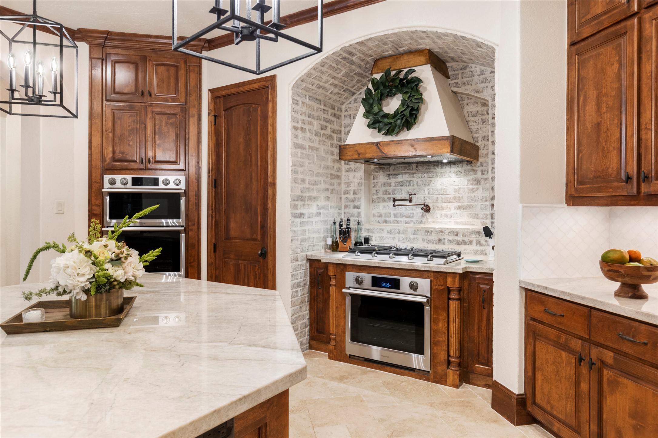 7421 Enchanted Stream Drive Conroe, TX 77304 - Photo 16 of 50 a kitchen with stainless steel appliances granite countertop a stove and a sink