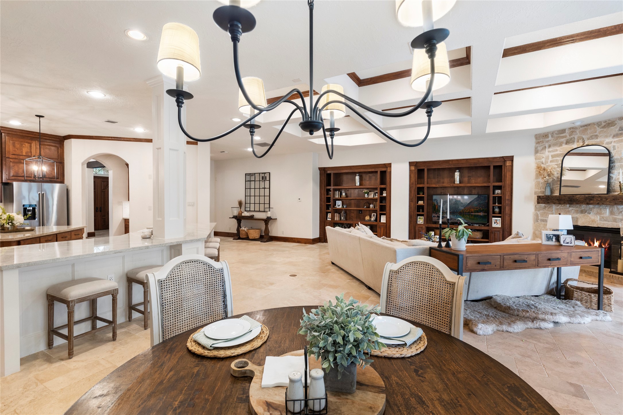 7421 Enchanted Stream Drive Conroe, TX 77304 - Photo 49 of 50 a living room with furniture a chandelier and a floor to ceiling window