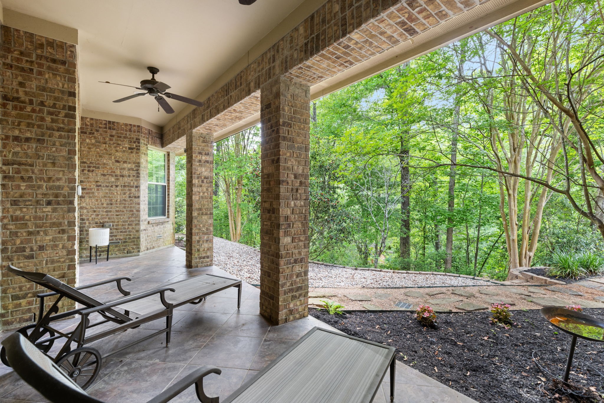 7421 Enchanted Stream Drive Conroe, TX 77304 - Photo 25 of 50 a living room with furniture and a floor to ceiling window