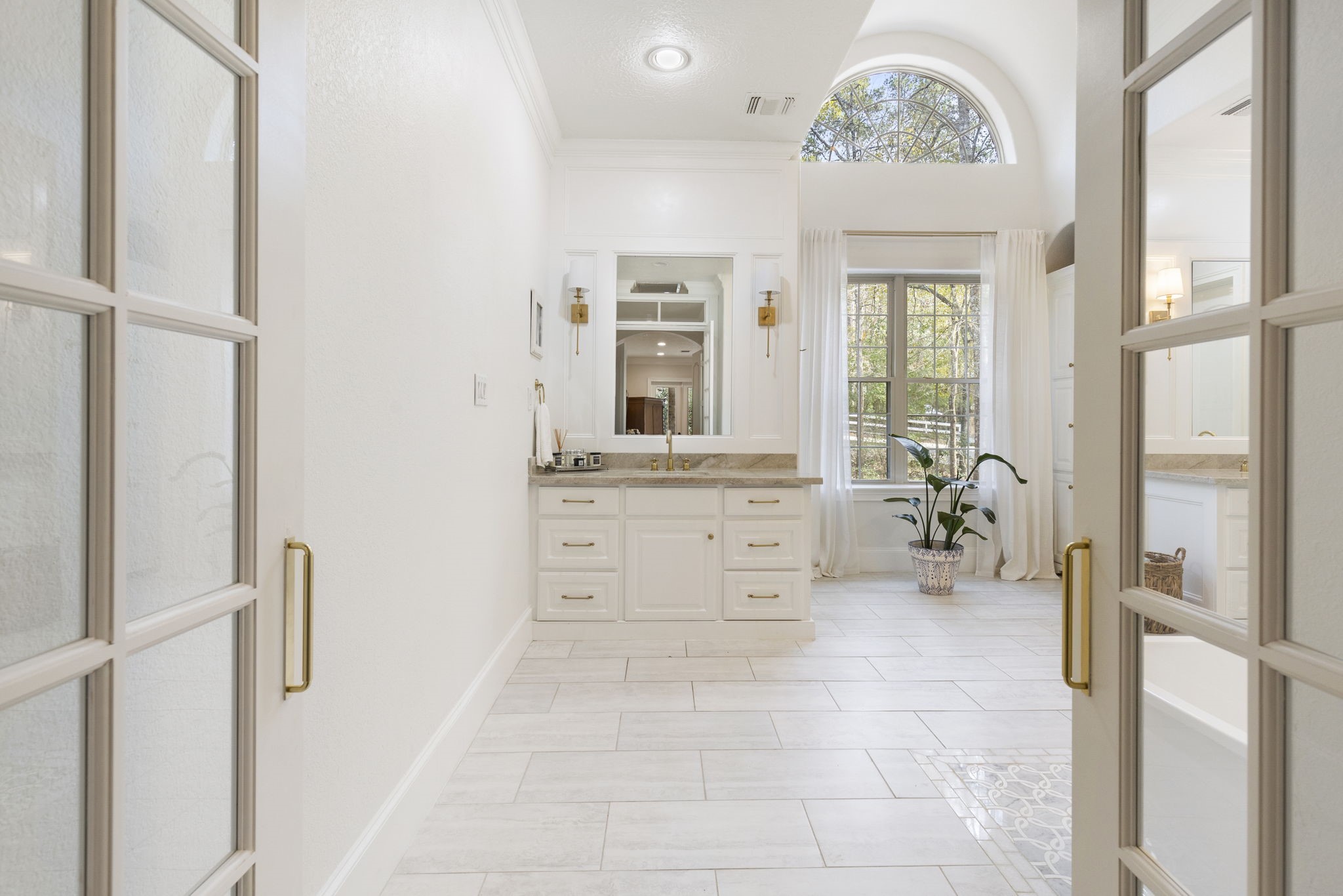 7421 Enchanted Stream Drive Conroe, TX 77304 - Photo 26 of 50 a spacious bathroom with a double vanity sink and a mirror