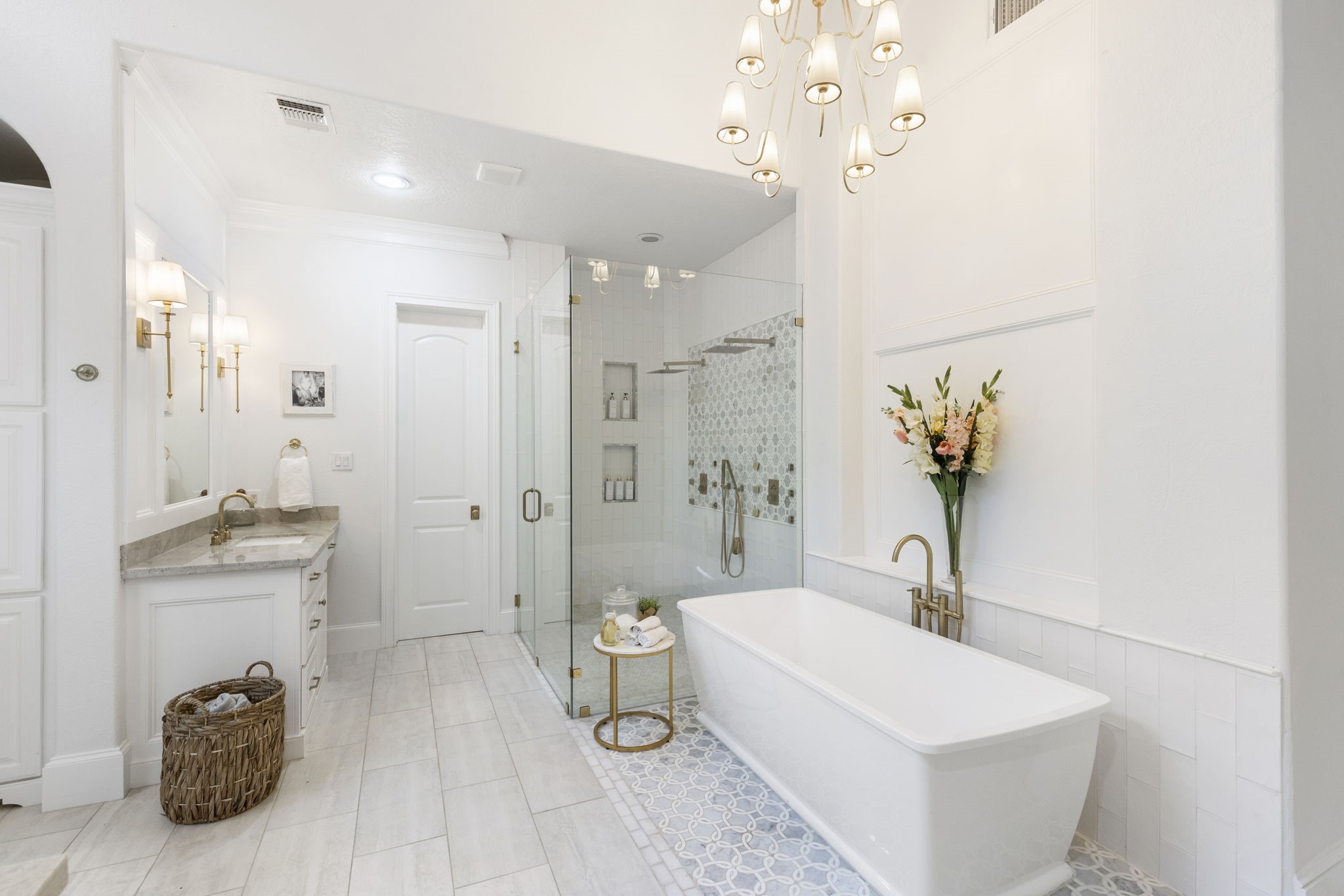 7421 Enchanted Stream Drive Conroe, TX 77304 - Photo 27 of 50 a spacious bathroom with a sink a toilet a mirror and shower