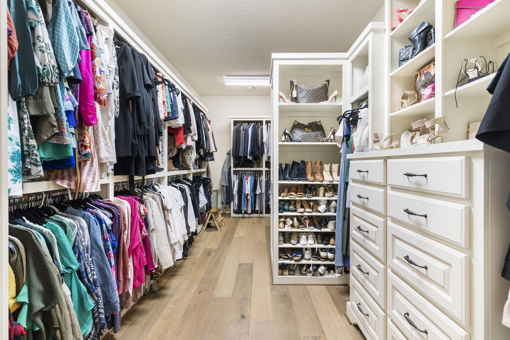 7421 Enchanted Stream Drive Conroe, TX 77304 - Photo 28 of 50 a view of walk in closet with clothes and shoes