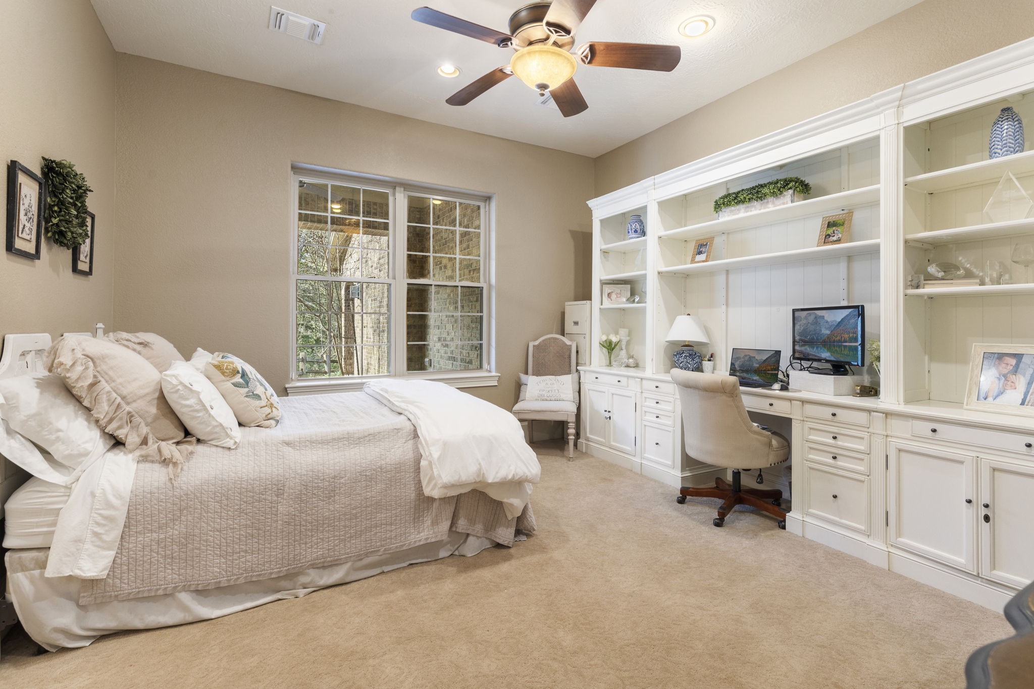 7421 Enchanted Stream Drive Conroe, TX 77304 - Photo 29 of 50 a bed room with a bed and a chair