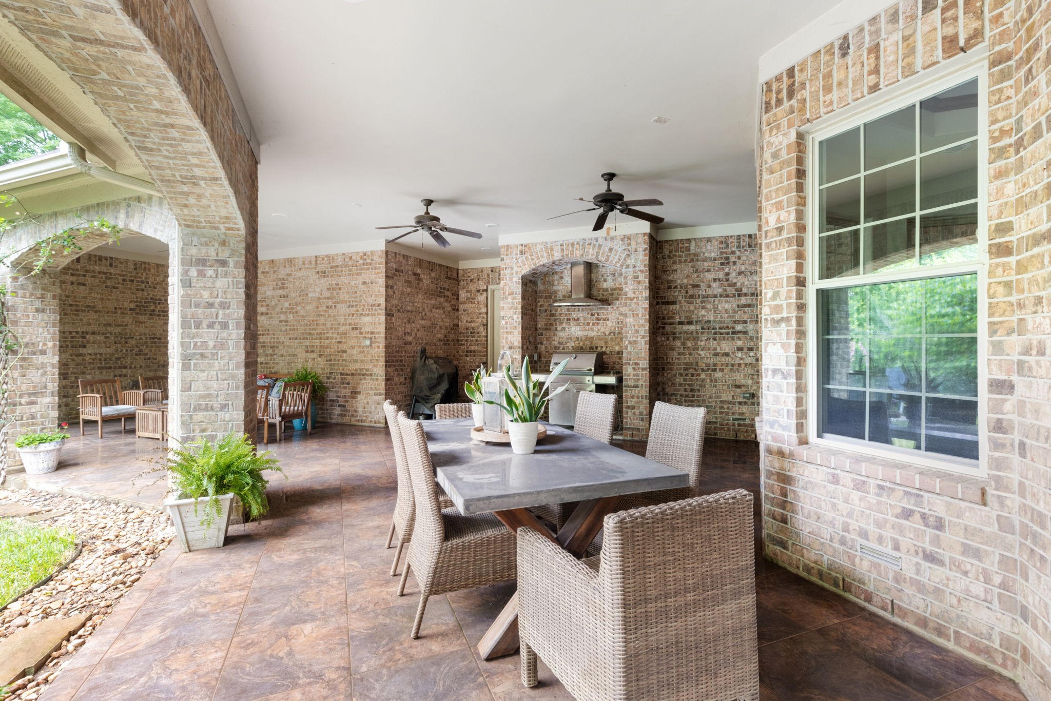 7421 Enchanted Stream Drive Conroe, TX 77304 - Photo 40 of 50 a view of an outdoor dining space with furniture