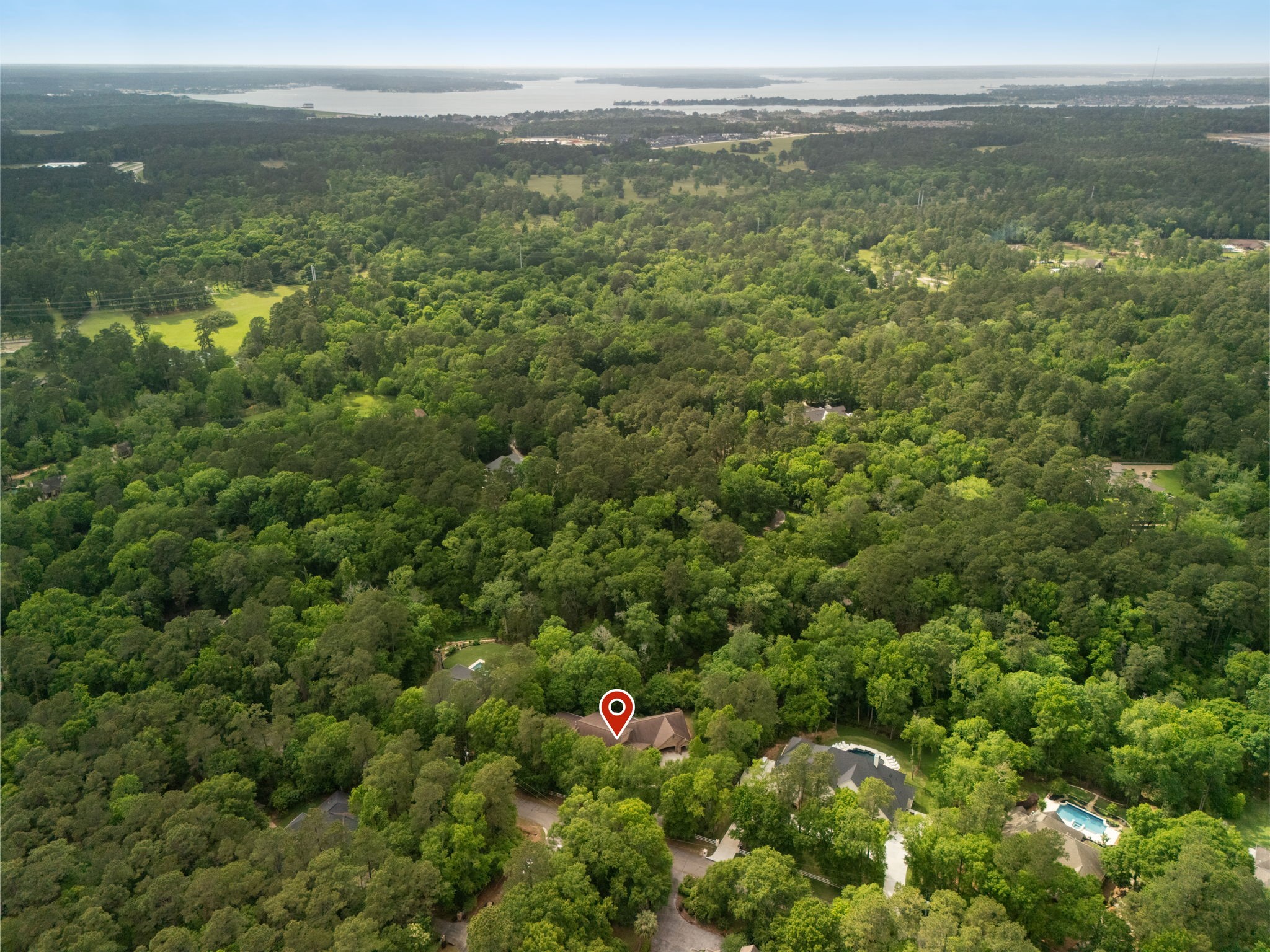 7421 Enchanted Stream Drive Conroe, TX 77304 - Photo 6 of 50 a view of a city with lush green forest