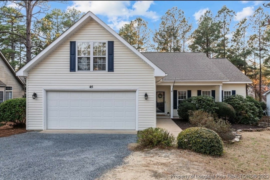 45 Sawmill Road West Pinehurst, NC 28374 - Photo 1 of 36 a front view of a house with garden