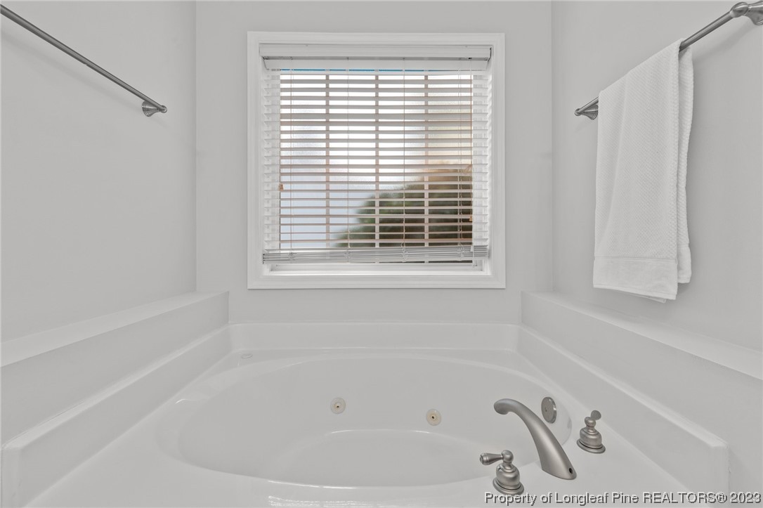 45 Sawmill Road West Pinehurst, NC 28374 - Photo 19 of 36 a white bath tub sitting next to a window