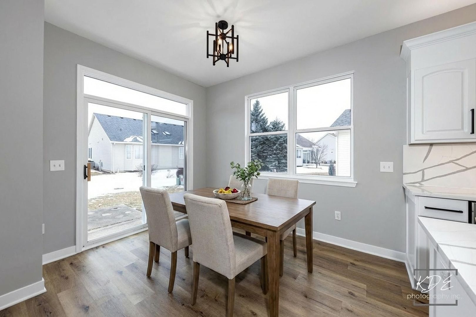 733 Mecosta Lane Romeoville, IL 60446 - Photo 12 of 36 a dining room with furniture window wooden floor