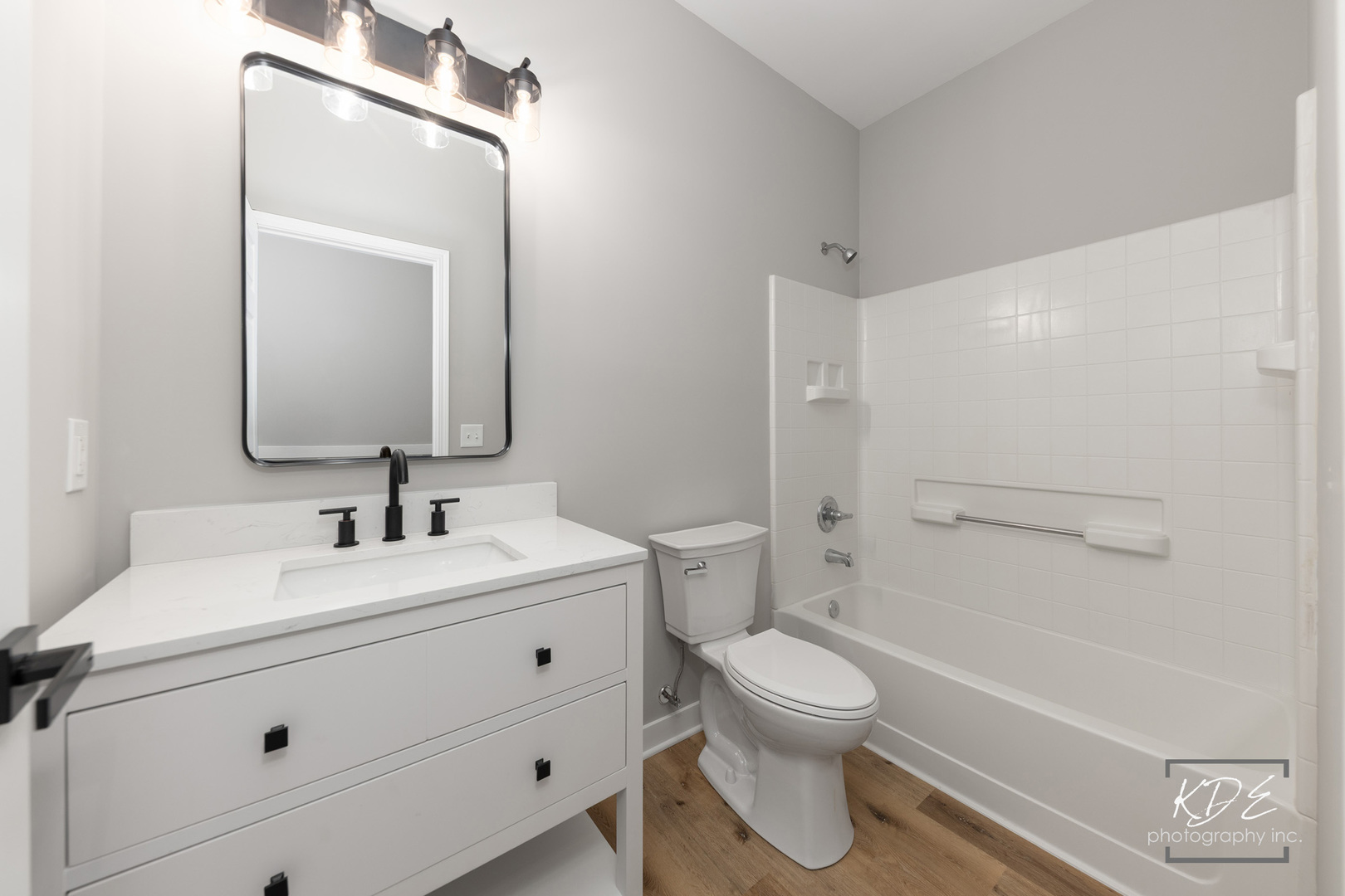 733 Mecosta Lane Romeoville, IL 60446 - Photo 15 of 36 a bathroom with a toilet sink a mirror and shower