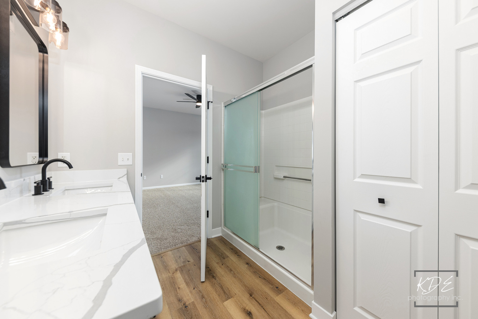 733 Mecosta Lane Romeoville, IL 60446 - Photo 17 of 36 a bathroom with a shower sink and mirror