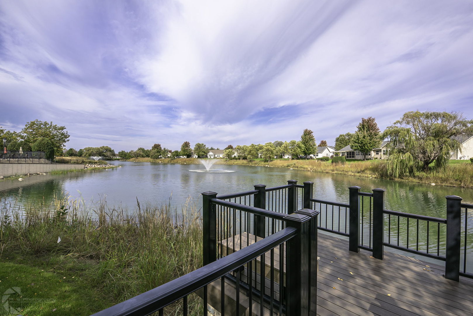 733 Mecosta Lane Romeoville, IL 60446 - Photo 36 of 36 a view of a lake from a balcony