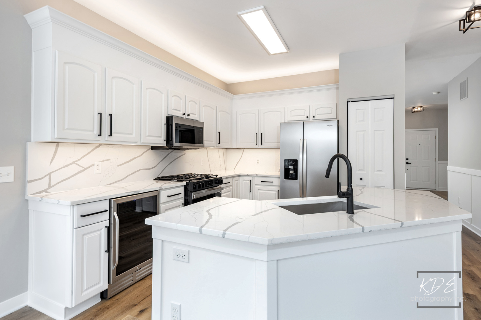 733 Mecosta Lane Romeoville, IL 60446 - Photo 7 of 36 a kitchen with a sink a stove and refrigerator