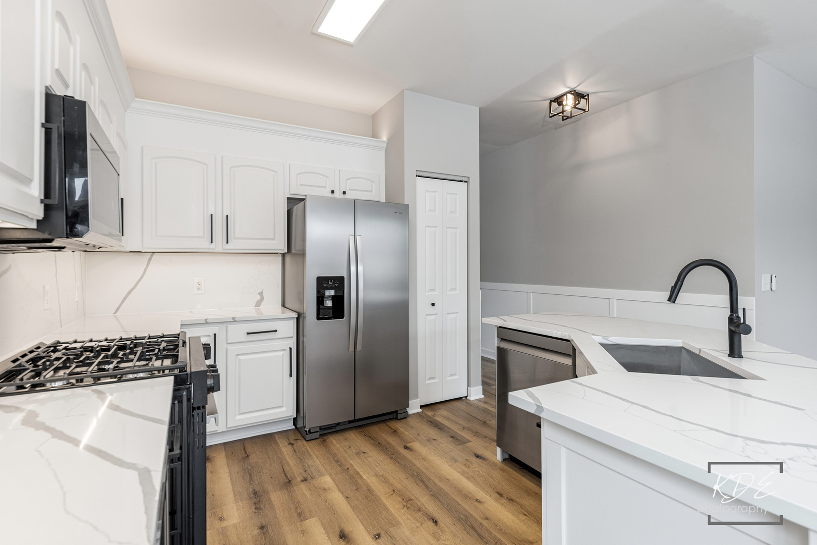 733 Mecosta Lane Romeoville, IL 60446 - Photo 9 of 36 a kitchen with a refrigerator and a sink