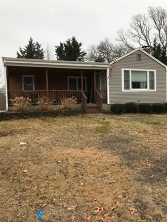 52 Puritan Road Bourne, MA 02532 - Photo 1 of 8 a front view of house with yard space and seating