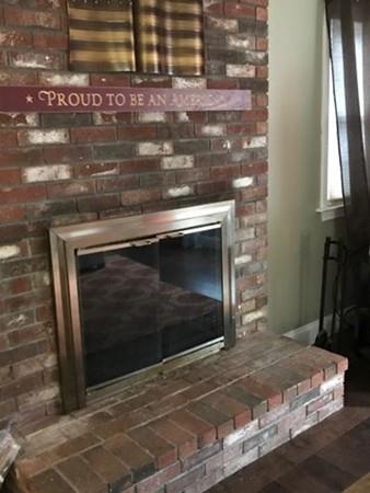 52 Puritan Road Bourne, MA 02532 - Photo 6 of 8 a stove top oven sitting inside of a kitchen
