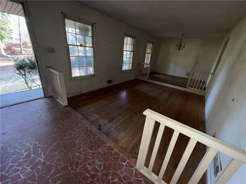 3955 Demooney Road Atlanta, GA 30349 - Photo 15 of 26 a view of wooden floor and windows in a room