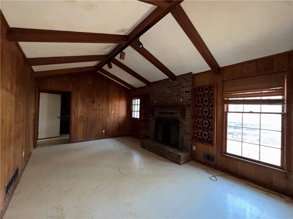 3955 Demooney Road Atlanta, GA 30349 - Photo 16 of 26 a view of an empty room with a fireplace and a window