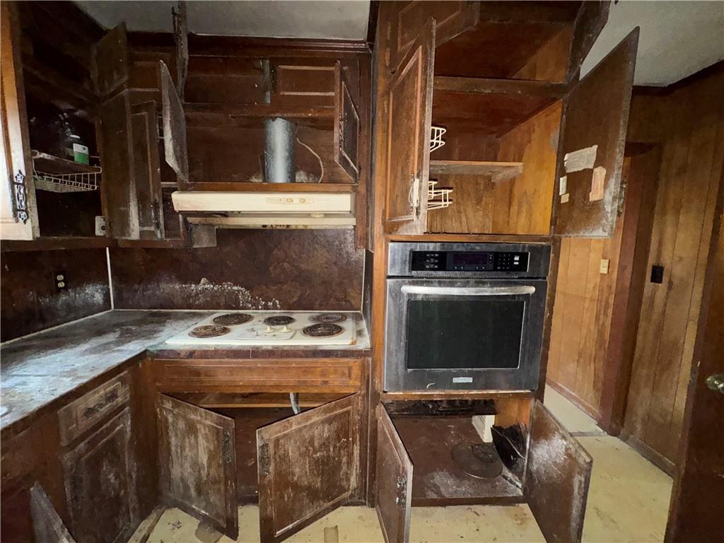 3955 Demooney Road Atlanta, GA 30349 - Photo 19 of 26 a kitchen with a stove and a sink