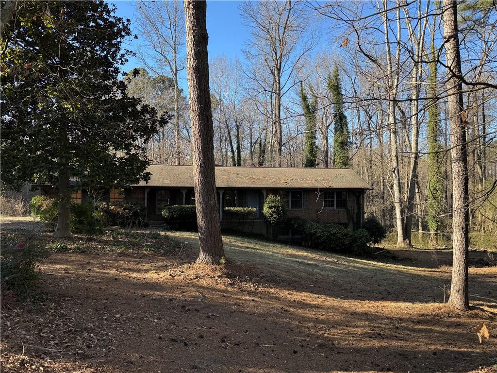 3955 Demooney Road Atlanta, GA 30349 - Photo 2 of 26 a front view of a house with yard