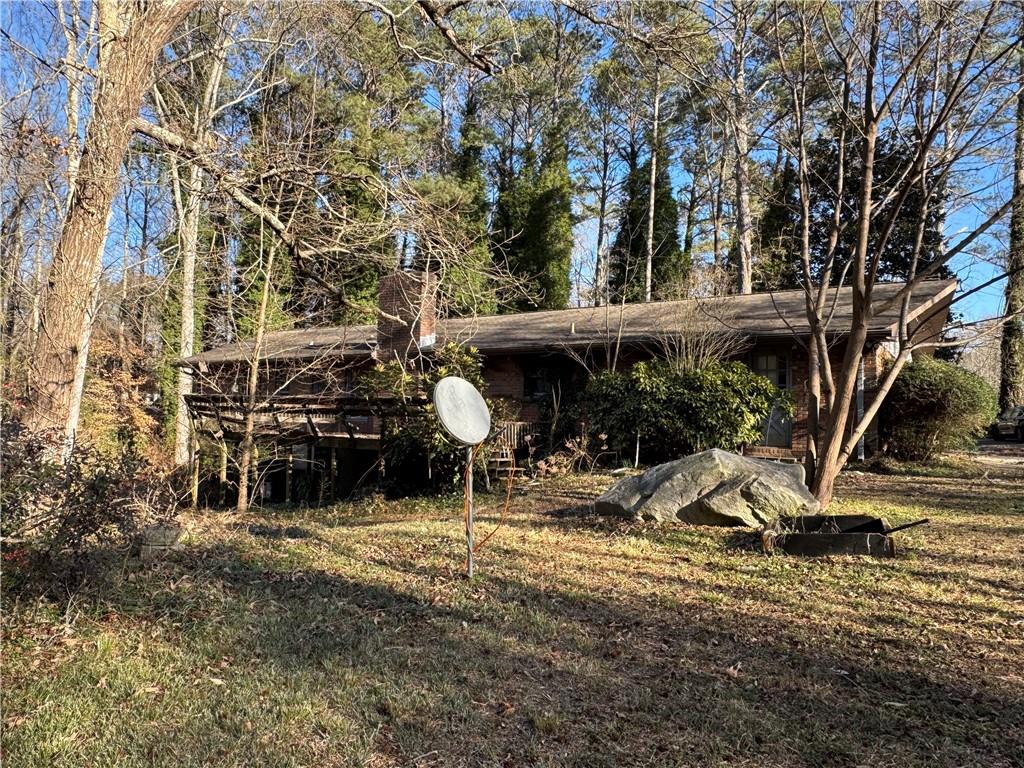 3955 Demooney Road Atlanta, GA 30349 - Photo 4 of 26 a view of a house with backyard