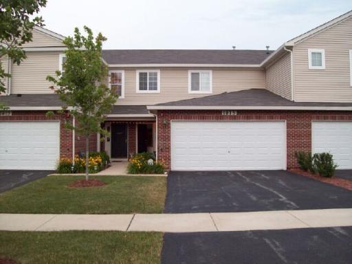 1015 Fieldside Drive Matteson, IL 60443 - Photo 1 of 1 a front view of a house with a yard and garage
