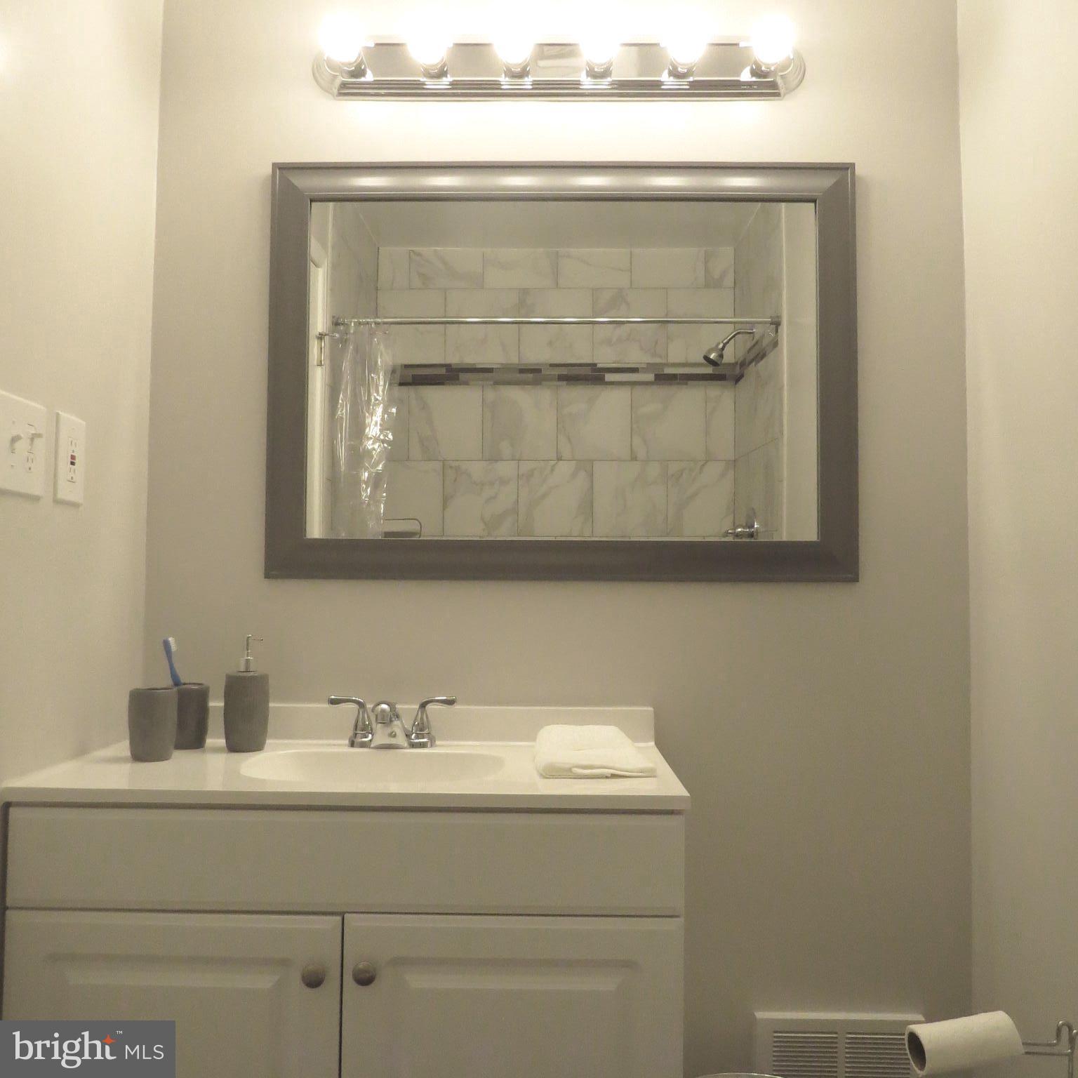 9707 Botsford Road Manassas, VA 20109 - Photo 22 of 30 New vanity, floor, and tile,