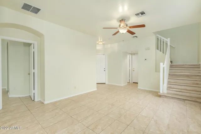 a kitchen with a refrigerator a sink and cabinets