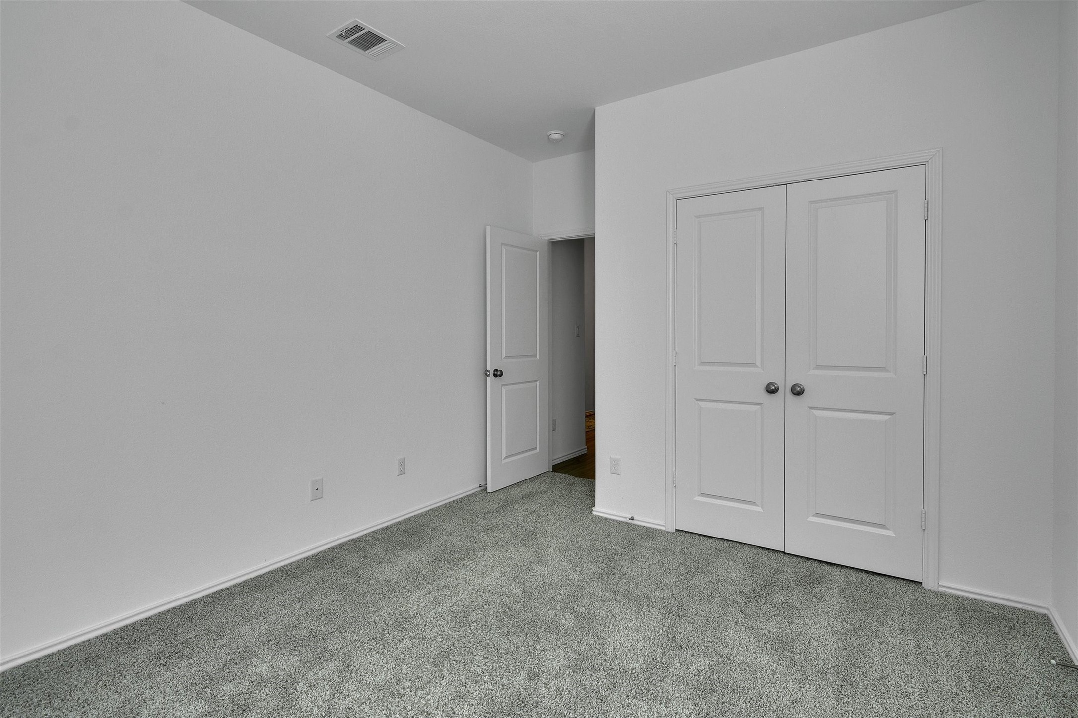 1621 Brueggerhoff Road Leander, TX 78641 - Photo 17 of 28 Unfurnished bedroom with a closet and carpet