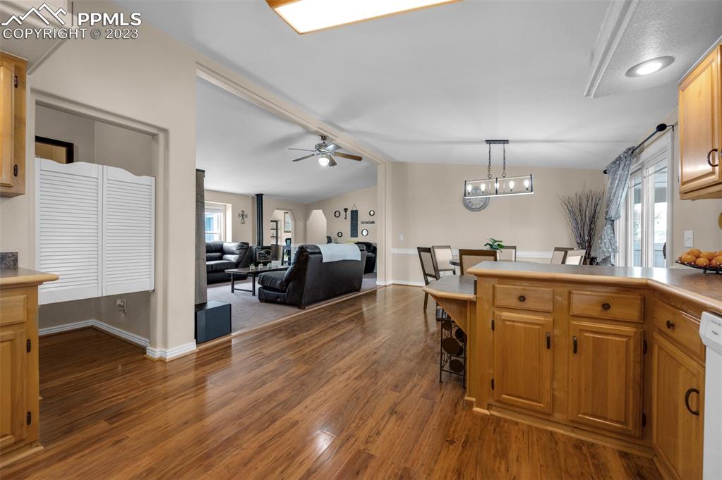 28230 Washington Road Calhan, CO 80808 - Photo 11 of 40 a view of a kitchen and dining room with wooden floor