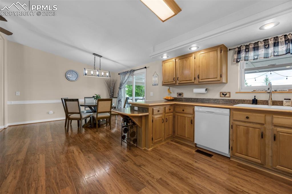 28230 Washington Road Calhan, CO 80808 - Photo 13 of 40 a kitchen with a sink cabinets and wooden floor