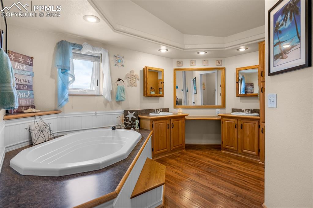 28230 Washington Road Calhan, CO 80808 - Photo 16 of 40 a bathroom with a sink and a mirror