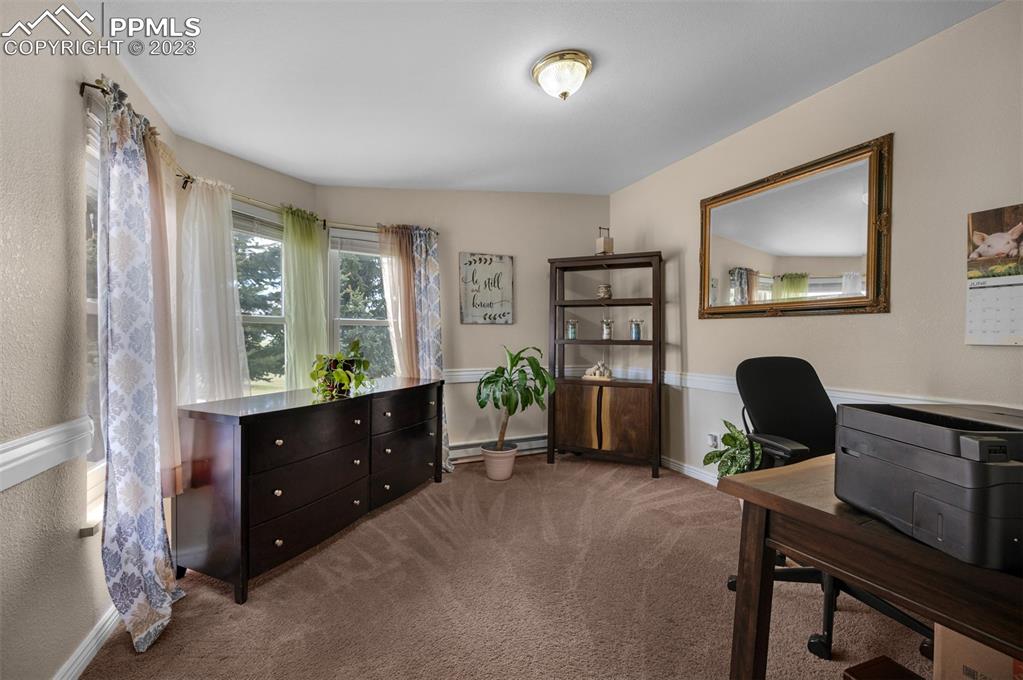 28230 Washington Road Calhan, CO 80808 - Photo 20 of 40 a living room with furniture and a window