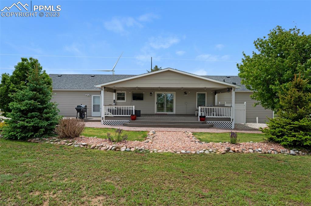 28230 Washington Road Calhan, CO 80808 - Photo 23 of 40 a front view of a house with swimming pool having outdoor seating