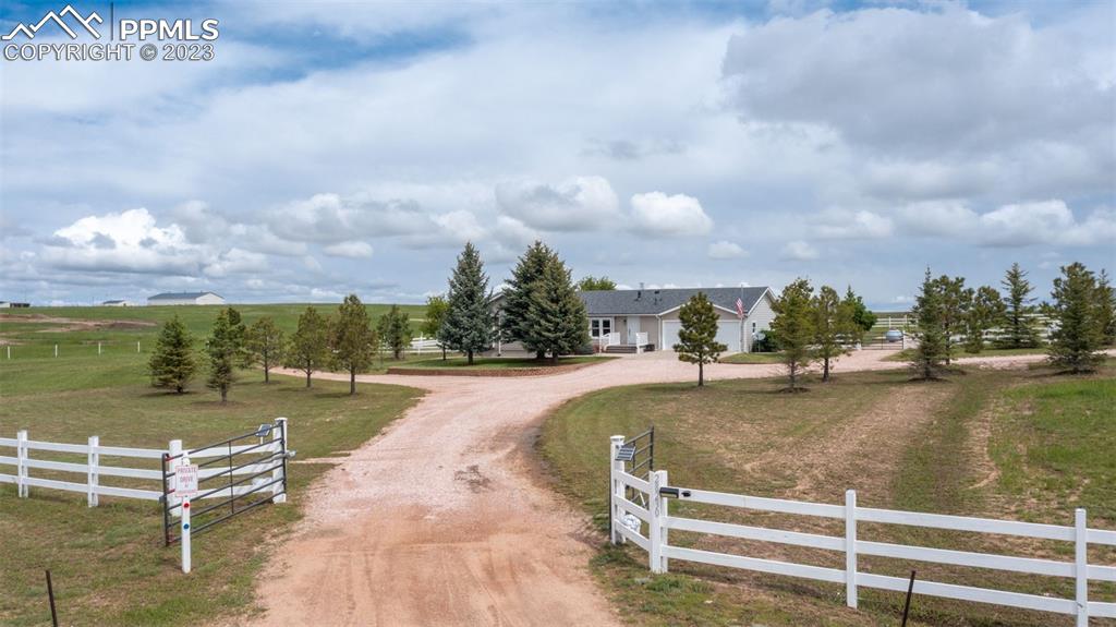 28230 Washington Road Calhan, CO 80808 - Photo 29 of 40 a view of a swimming pool with lawn chairs