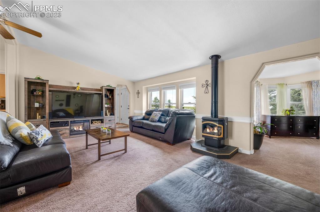 28230 Washington Road Calhan, CO 80808 - Photo 3 of 40 a living room with furniture and a flat screen tv