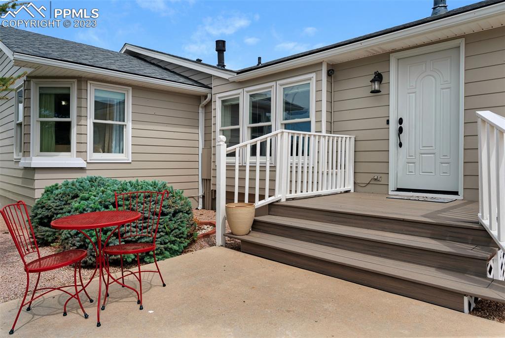 28230 Washington Road Calhan, CO 80808 - Photo 34 of 40 a front view of a house with porch and seating space