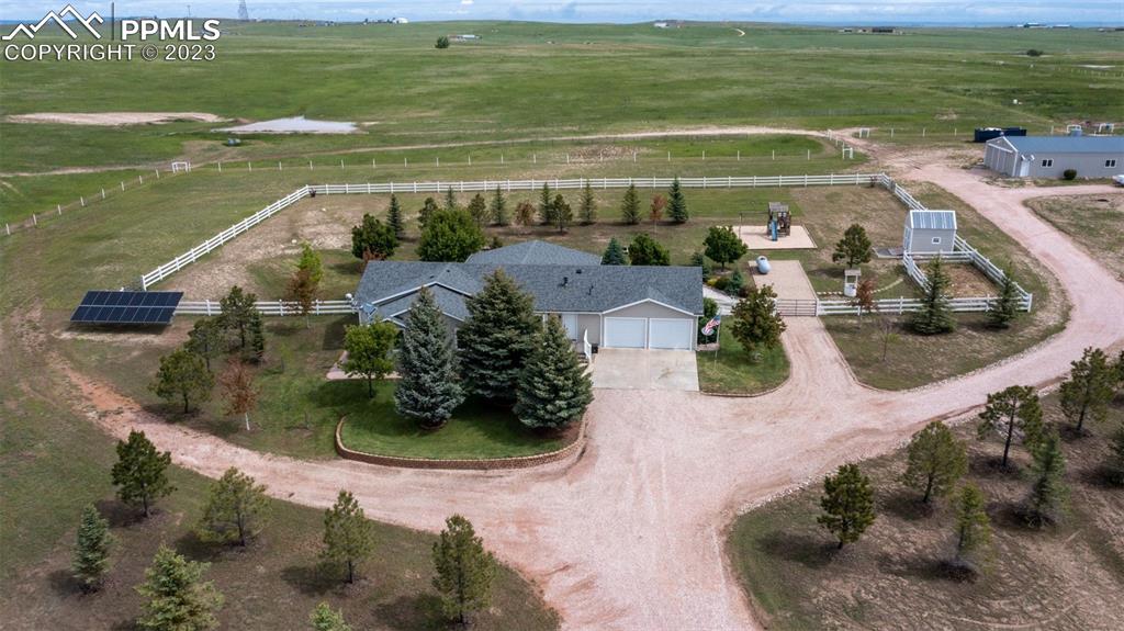 28230 Washington Road Calhan, CO 80808 - Photo 40 of 40 a view of a garden with lawn chairs