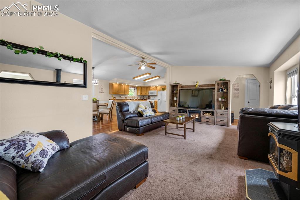 28230 Washington Road Calhan, CO 80808 - Photo 6 of 40 a living room with furniture and a flat screen tv
