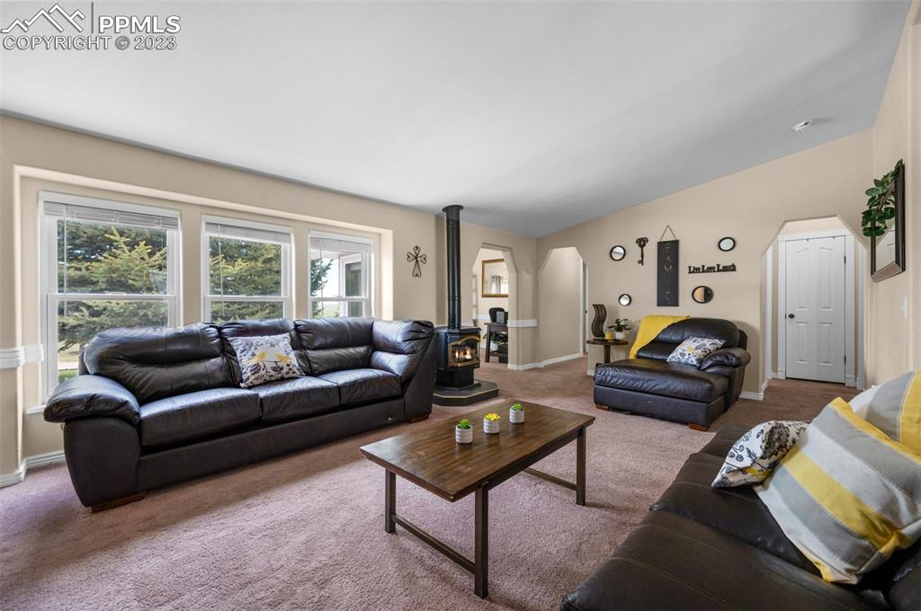 28230 Washington Road Calhan, CO 80808 - Photo 8 of 40 a living room with furniture and a large window