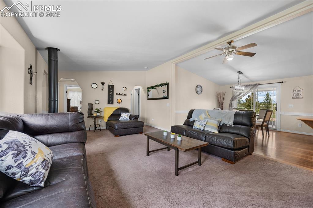 28230 Washington Road Calhan, CO 80808 - Photo 9 of 40 a living room with furniture and a chandelier