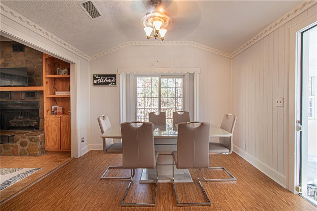 250 Nottingham Way Fairmount, GA 30139 - Photo 18 of 43 a view of a dining room with furniture window and wooden floor